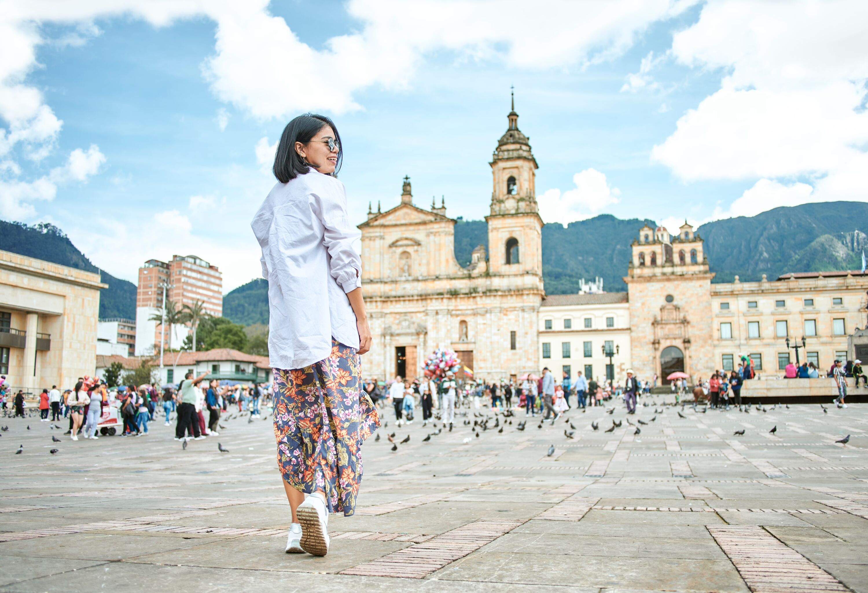 Woman walking in Bolivar square in Bogota