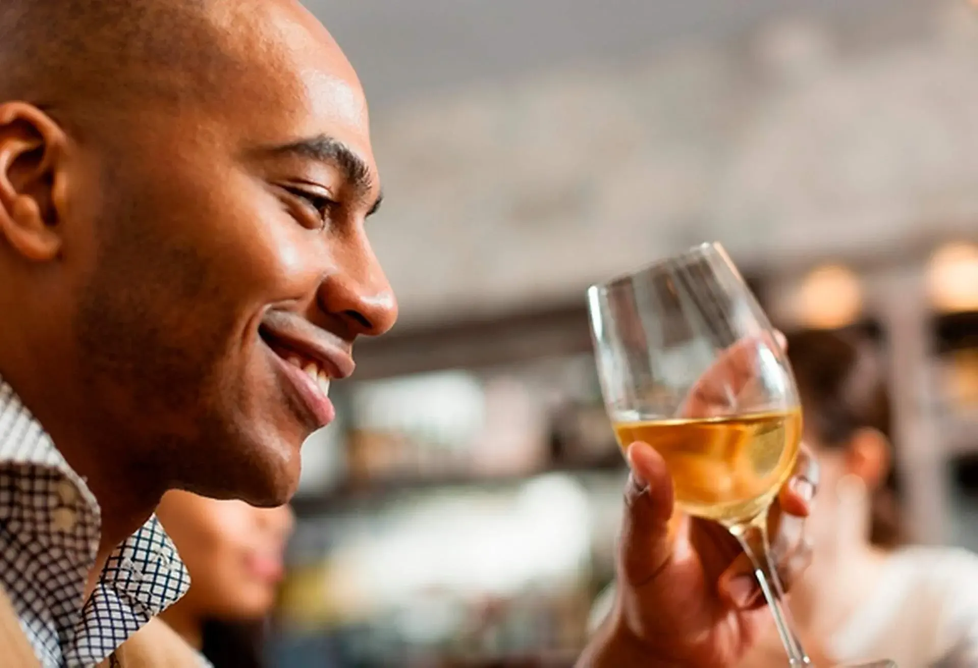 MAN_SMILING_WINE_GLASS_RESTAURANT