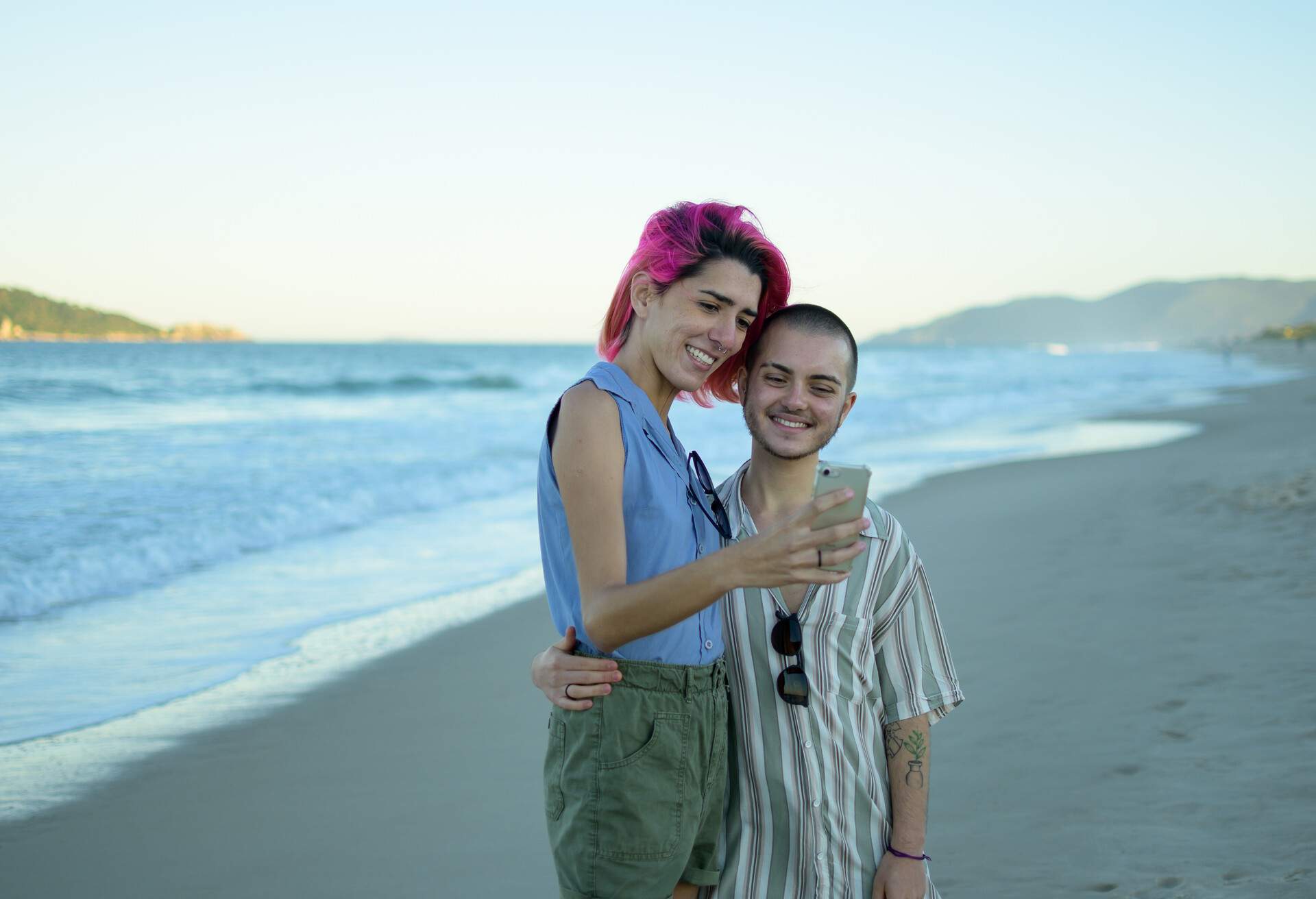 THEME_PEOPLE_TRANSGENDER_COUPLE_BEACH_DEVICE_GettyImages-1324638740