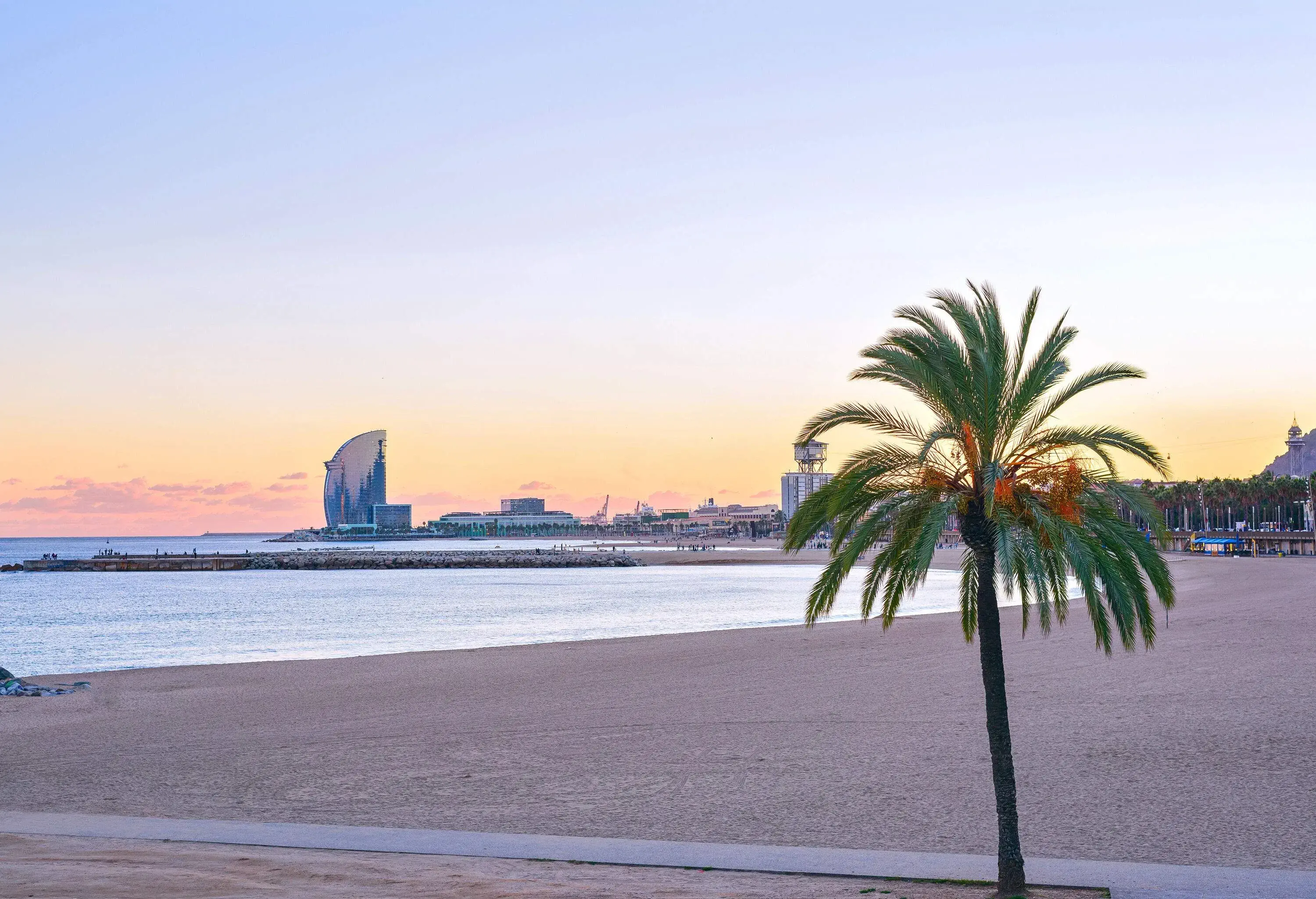 Beautiful Barcelona Beach at sunset Platja Nova Icaria or Barceloneta view